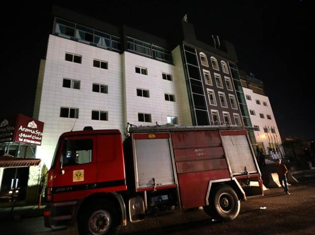 Iraqi firemen work at four-star Capitol Hotel in Arbil in northern Iraq on Friday night. (AFP) Iraqi firemen work at four-star Capitol Hotel in Arbil in northern Iraq on Friday night. (AFP)