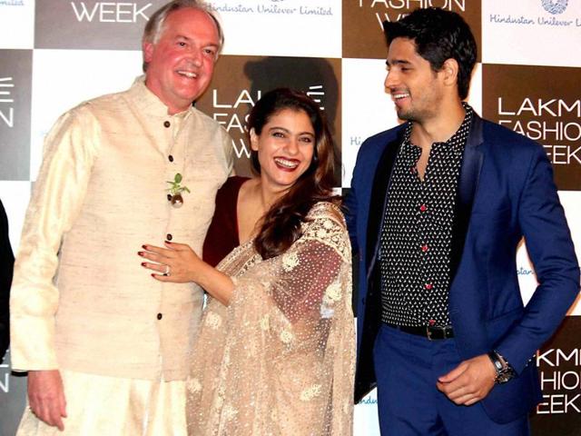 Kajol and Sidharth Malhotra with Global CEO, Hindustan Unilever Limited, Paul Polman at the curtain raiser event of Lakme Fashion Week in Mumbai. (PTI) 