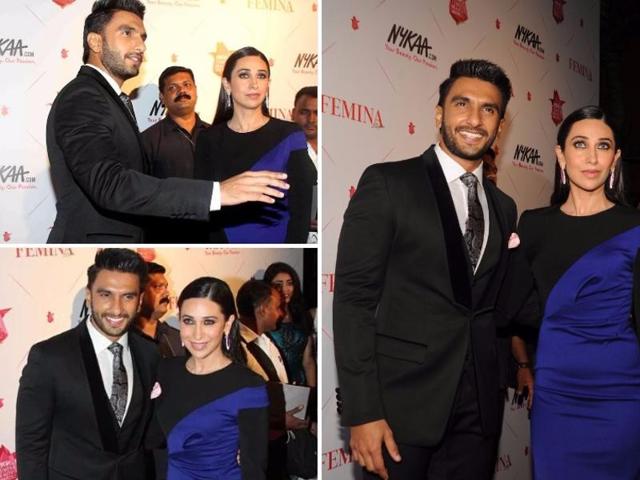 Bollywood actor Karisma Kapoor makes a bold statement with her blue-and-black number as she posed with Ranveer at Femina Beauty Awards in Mumbai. (AFP)