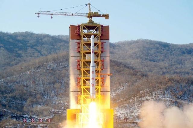 A North Korean long-range rocket is launched into the air at the Sohae rocket launch site of North Korea on Sunday. (Reuters)