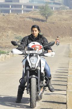 Pooja Dhabi rides her bike in Pune. (HT Photo)