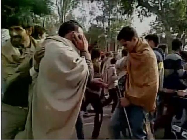 A party worker reloading his rifle during the celebration rally of a Samajwadi Party leader winning local polls. (ANI screengrab) A party worker reloading his rifle during the celebration rally of a Samajwadi Party leader winning local polls. (ANI screengrab)