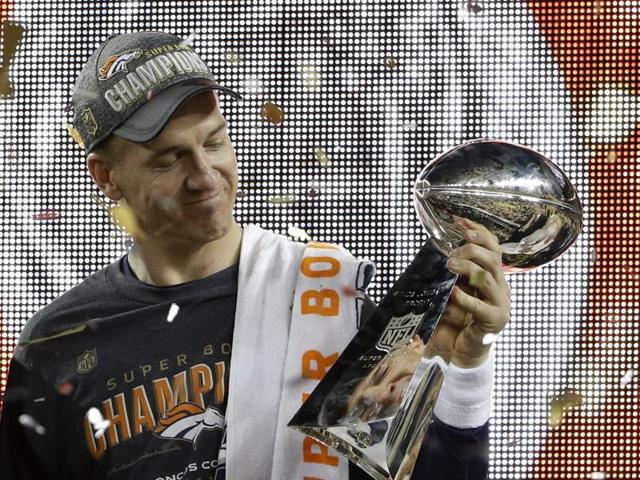 Denver Broncos’ Peyton Manning (18) holds up the trophy after the NFL Super Bowl 50. (AP Photo) 