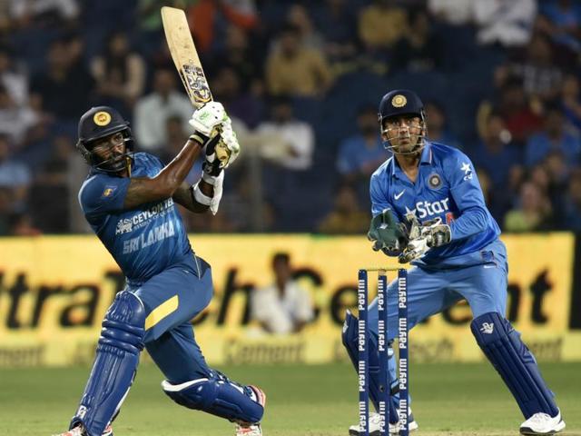 Chamara Kapugedera hits a shot as Dhoni watches. (Kunal Patil/HT Photo) Chamara Kapugedera hits a shot as Dhoni watches. (Kunal Patil/HT Photo)
