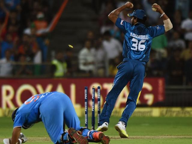 Sri Lanka's Dinesh Chandimal celebrates after the run out of India's Jasprit Bumrah. (AFP Photo) Sri Lanka's Dinesh Chandimal celebrates after the run out of India's Jasprit Bumrah. (AFP Photo)