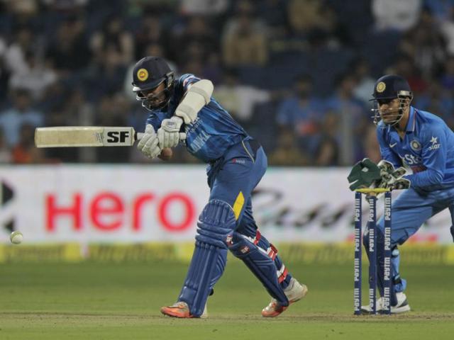Sri Lanka' s Dinesh Chandimal hits a shot as MS Dhoni watches. (AP Photo) Sri Lanka' s Dinesh Chandimal hits a shot as MS Dhoni watches. (AP Photo)