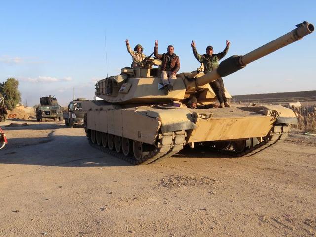 Iraqi pro-governement forces stand on their armoured vehicles on February 8, 2016 in the area of Jwaibah, on the eastern outskirts of Ramadi, after they retook the region from Islamic State (IS) group jihadists. (AFP) Iraqi pro-governement forces stand on their armoured vehicles on February 8, 2016 in the area of Jwaibah, on the eastern outskirts of Ramadi, after they retook the region from Islamic State (IS) group jihadists. (AFP)