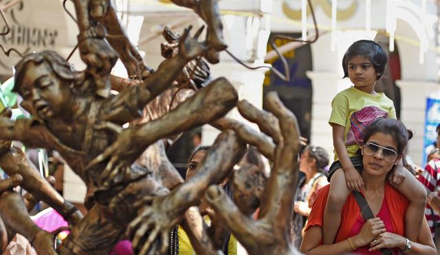 Visitors admire an art installation at the Kala Ghoda arts festival in Mumbai. (PTI)
