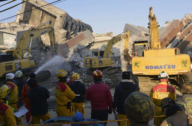 Rescuers deployed heavy machinery in a renewed effort to locate more than 100 people trapped in the rubble of a Taiwan apartment complex felled by an earthquake. (AFP)