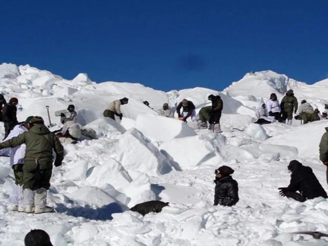 Indian army personnel search for survivors after a deadly avalanche on the Siachen glacier. An Indian soldier rescued nearly a week after he was buried by a deadly avalanche on the world's highest battleground was Tuesday airlifted to Delhi in critical but stable condition, the army said.(AFP)