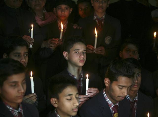 Students take part in a candlelight vigil for the Indian soldiers who died in an avalanche at the Siachen Glacier, in Jammu. (REUTERS) Students take part in a candlelight vigil for the Indian soldiers who died in an avalanche at the Siachen Glacier, in Jammu. (REUTERS)