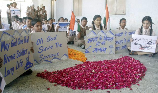 School students pay tributes to the Siachen avalanche martyrs in Ahmedabad. (PTI Photo) School students pay tributes to the Siachen avalanche martyrs in Ahmedabad. (PTI Photo)