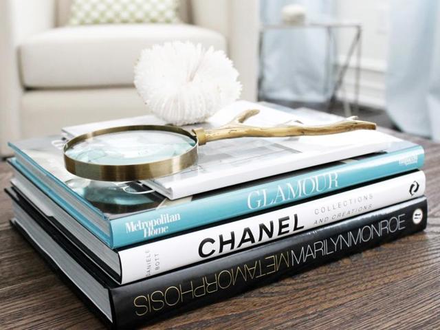 Stacked coffee table books. No surprise here, no fashionable person’s home is complete with a serious stack of coffee table books paying homage to fashion favorites like Chanel. (PINTEREST) Stacked coffee table books. No surprise here, no fashionable person’s home is complete with a serious stack of coffee table books paying homage to fashion favorites like Chanel. (PINTEREST)
