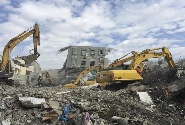 This file picture taken on February 6, 2016 shows rescue personnel working at the site of a collapsed building in the southern Taiwanese city of Tainan.(AFP)