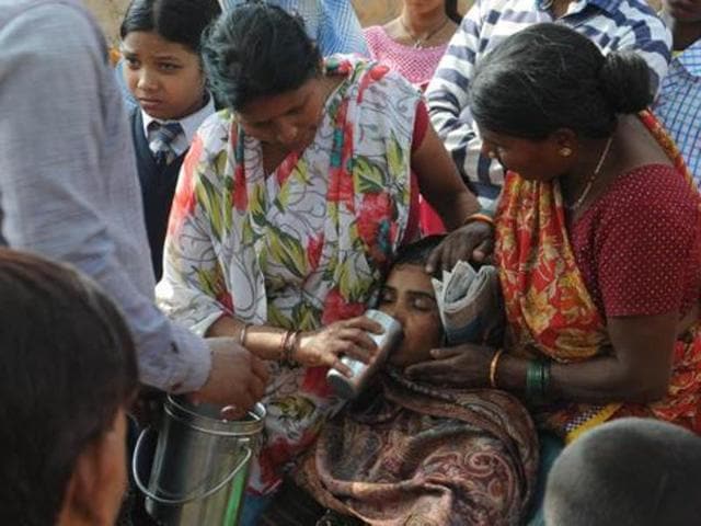 Villagers console the mother of the 12-year-old boy who was allegedly murdered by a student of Sapphire International School in Ranchi.(HT photo)