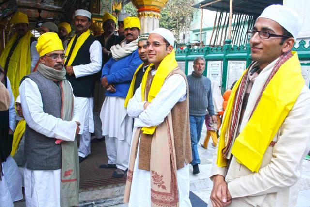 Devotees come dressed in yellow to mark the day. (Mayank Austen Soofi/ HT photo)