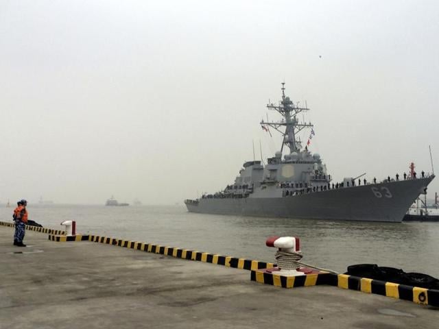 A ship (top) of the Chinese Coast Guard is seen near a ship of the Vietnam Marine Guard in the South China Sea. China has reacted sharply to a report suggesting that the United States and India were planning joint patrols of the disputed South China Seas region.(REUTERS Photo)