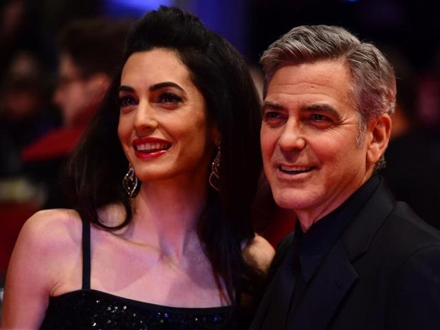 As US actor George Clooney (R) and his wife Amal Alamuddin pose for photographers the 66th Berlinale Film Festival in Berlin, it is clear that camera just loves Clooney -- we mean the wife. (AFP)