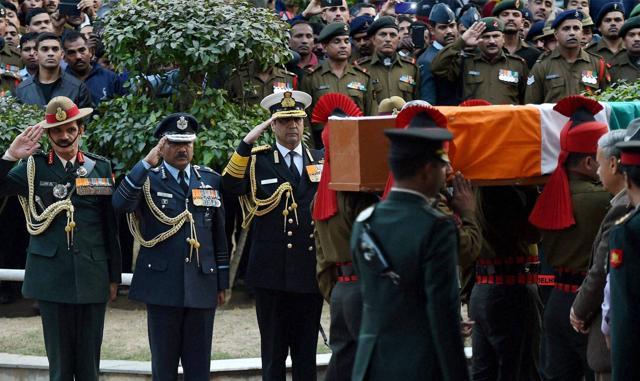 Indian Army chief General Dalbir Singh Suhag, air chief Marshal Arup Raha and navy chief Admiral Robin K Dhowan pay homage to Lance Naik Hanumanthappa Koppad at Brar Square in New Delhi. (PTI Photo) Indian Army chief General Dalbir Singh Suhag, air chief Marshal Arup Raha and navy chief Admiral Robin K Dhowan pay homage to Lance Naik Hanumanthappa Koppad at Brar Square in New Delhi. (PTI Photo)