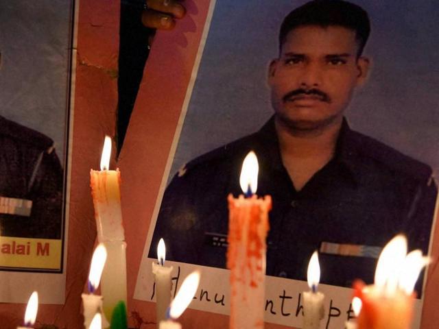 NSUI workers hold a candle light tribute for the soldiers who lost their lives after an avalanche hit an Indian Army post in Siachen. (PTI Photo) NSUI workers hold a candle light tribute for the soldiers who lost their lives after an avalanche hit an Indian Army post in Siachen. (PTI Photo)