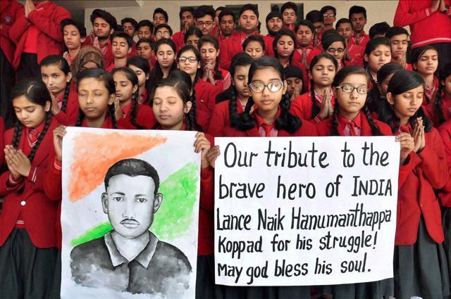 Children observe a minute of silence to honour Lance Naik Hanamanthappa Koppad, the Indian Army soldier who died at the army hospital in New Delhi, in Moradabad. (PTI Photo) Children observe a minute of silence to honour Lance Naik Hanamanthappa Koppad, the Indian Army soldier who died at the army hospital in New Delhi, in Moradabad. (PTI Photo)