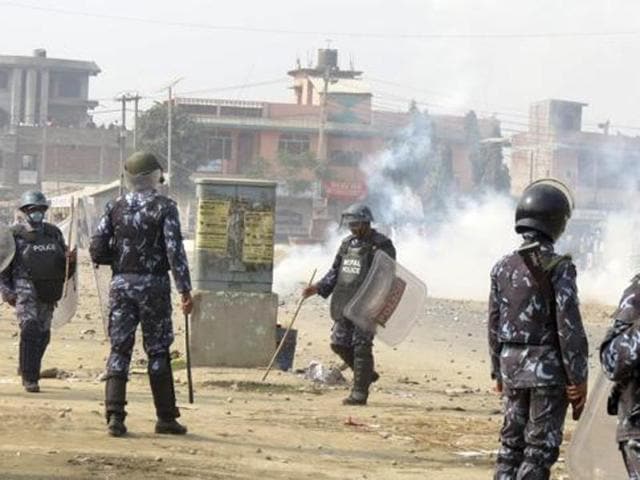 Nepalese policemen use tear gas to disperse ethnic Madhesi protesters in Gaur, a town about 160 km south of Kathmandue. (AP Photo/Gautham Shreshta)(AP) Nepalese policemen use tear gas to disperse ethnic Madhesi protesters in Gaur, a town about 160 km south of Kathmandue. (AP Photo/Gautham Shreshta)(AP)
