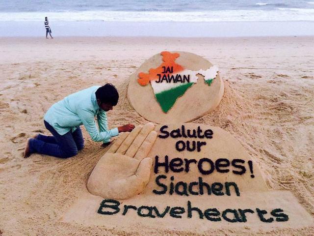 Sand artist Sudarsan Pattnaik pays tribute to Lance Naik Hanumanthappa Koppad at Puri sea beach. The Siachen tragedy united India, otherwise broken by political controversies, caste barriers and ideologies. (PTI) Sand artist Sudarsan Pattnaik pays tribute to Lance Naik Hanumanthappa Koppad at Puri sea beach. The Siachen tragedy united India, otherwise broken by political controversies, caste barriers and ideologies. (PTI)