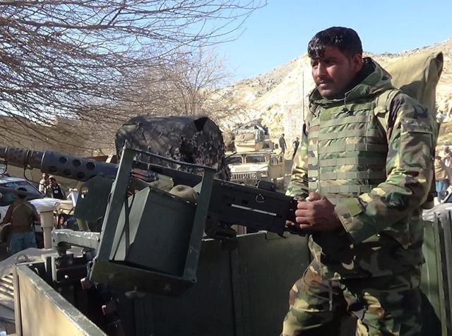 A member of the Afghan security forces keeps watch following clashes with Islamic State (IS) fighters in Kot district.(AFP)