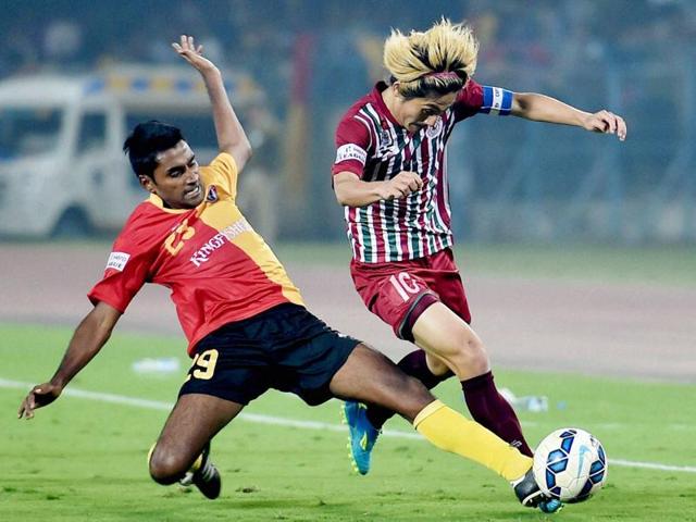 Soumik Dey of East Bengal and Katsumi Yusa of Mohun Bagan vie for the ball during their I-League match. (PTI Photo) Soumik Dey of East Bengal and Katsumi Yusa of Mohun Bagan vie for the ball during their I-League match. (PTI Photo)