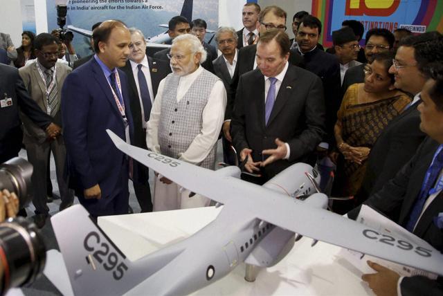 Prime Minister Narendra Modi with other dignitaries interact with chairman of Tata Sons Cyrus Mistry at the 'Make in India Week' in Mumbai.  (PTI Photo)
