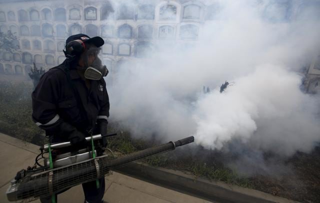 A health worker fumigates as part of preventive measures against the Zika virus and other mosquito-borne diseases, at the cemetery of Presbitero Maestro in Lima, Peru. (Reuters Photo) A health worker fumigates as part of preventive measures against the Zika virus and other mosquito-borne diseases, at the cemetery of Presbitero Maestro in Lima, Peru. (Reuters Photo)