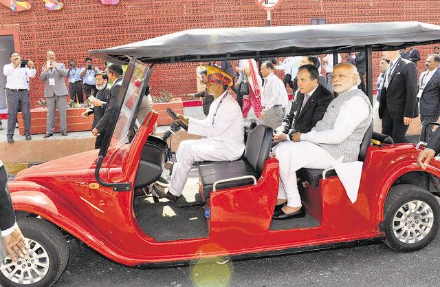 Prime Minister Narendra Modi with the Swedish counterpart Stefan Lofven riding a battery operated car at the Make in India Centre in Mumbai on Saturday. (PTI photo)