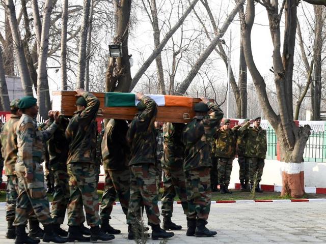 Army soldiers carrying the coffins of the soldiers, who were martyred in the Kupwara encounter, during a wreath-laying ceremony in Srinagar on Sunday. (Waseem Andrabi/ HT) Army soldiers carrying the coffins of the soldiers, who were martyred in the Kupwara encounter, during a wreath-laying ceremony in Srinagar on Sunday. (Waseem Andrabi/ HT)