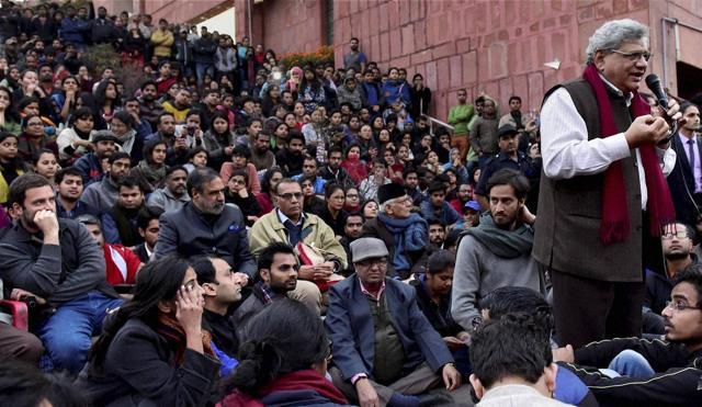 General-secretary of CPI(M) Sitaram Yechury addresses students of the Jawaharlal Nehru University (JNU) as Congress vice-president Rahul Gandhi (L) looks on, in New Delhi. Yechury and Gandhi went to the campus to meet the students protesting for the release of student union president Kanhaiya Kumar. (PTI Photo) General-secretary of CPI(M) Sitaram Yechury addresses students of the Jawaharlal Nehru University (JNU) as Congress vice-president Rahul Gandhi (L) looks on, in New Delhi. Yechury and Gandhi went to the campus to meet the students protesting for the release of student union president Kanhaiya Kumar. (PTI Photo)
