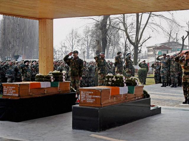 General officer commanding 15 corps lt gen Satish Dua paying floral tributes to two army soldiers during the wreath-laying ceremony. (PTI Photo) General officer commanding 15 corps lt gen Satish Dua paying floral tributes to two army soldiers during the wreath-laying ceremony. (PTI Photo)