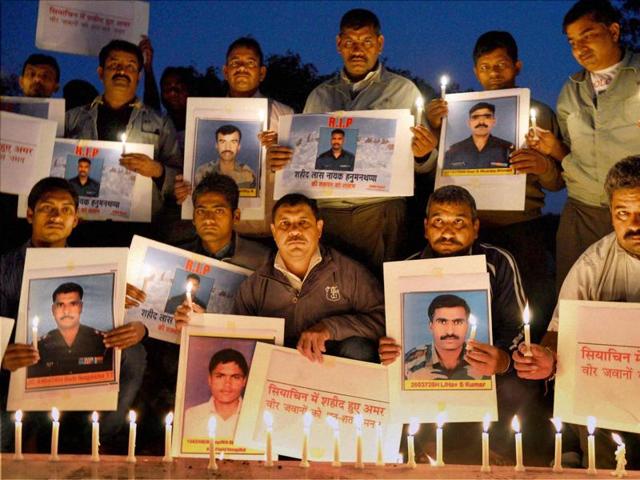 A group of social activists pay their homage to the soldiers who lost their lives after an avalanche hit their post in Siachen, Jammy and Kashmir. (PTI Photo) A group of social activists pay their homage to the soldiers who lost their lives after an avalanche hit their post in Siachen, Jammy and Kashmir. (PTI Photo)