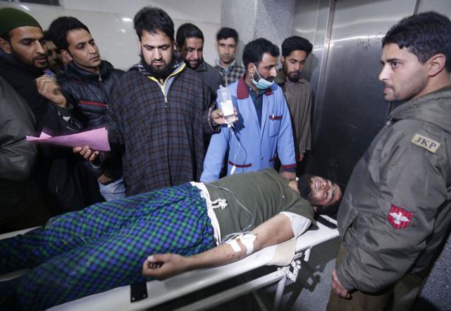 People move an injured person on a stretcher for treatment at a local hospital in Srinagar on Sunday, 14 February 2016. A youth and a woman died in clashes with the security forces in Pulwama district of Jammu and Kashmir. (Waseem Andrabi / HT Photo) People move an injured person on a stretcher for treatment at a local hospital in Srinagar on Sunday, 14 February 2016. A youth and a woman died in clashes with the security forces in Pulwama district of Jammu and Kashmir. (Waseem Andrabi / HT Photo)
