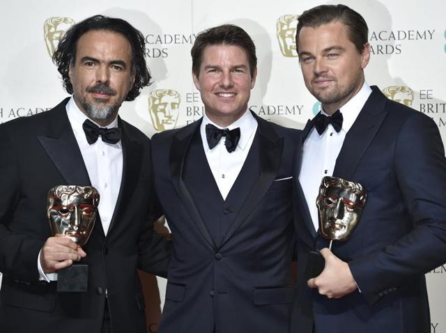 Best director Alejandro Inarritu (L) and best leading actor Leonardo DiCaprio hold their awards as they stand with presenter Tom Cruise at the British Academy of Film and Television Arts (BAFTA) Awards in London. (REUTERS) Best director Alejandro Inarritu (L) and best leading actor Leonardo DiCaprio hold their awards as they stand with presenter Tom Cruise at the British Academy of Film and Television Arts (BAFTA) Awards in London. (REUTERS)