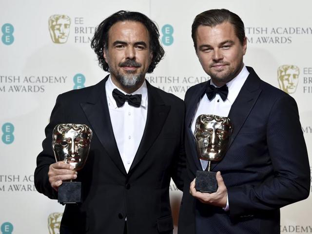 Leonardo DiCaprio poses with presenter Tom Cruise at the British Academy of Film and Television Arts (BAFTA) Awards at the Royal Opera House in London, February 14.(REUTERS)