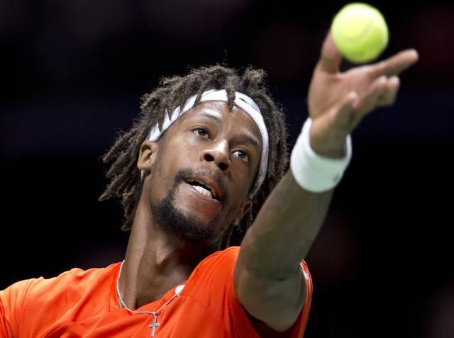 Gael Monfils hits a serve. (AP Photo)