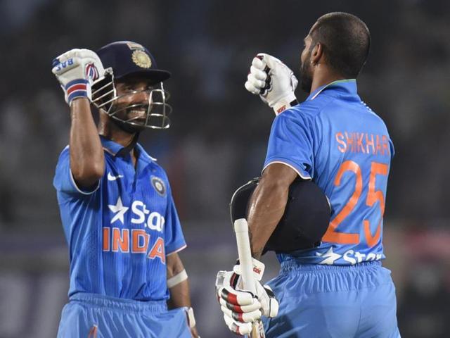 Shikhar Dhawan (right) and Ajinkya Rahane celebrate after guiding India past the victory line. (Ashok nath Dey/HT Photo) 