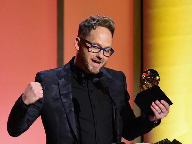 Christian hip-hop artist Tobymac receives the award for the Best Contemporary Christian Music Album, This Is Not A Test, onstage during the 58th Annual Grammy music Awards. (AFP) 