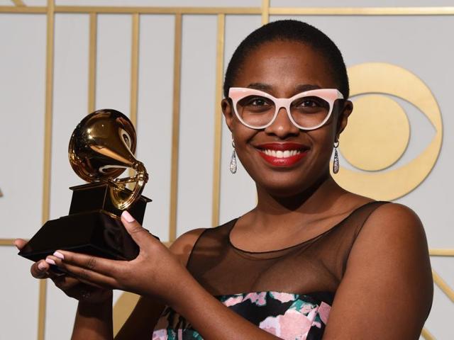 Cecile McLorin Salvant holds her trophy for Best Jazz Vocal Album titled For One To Love in the press room during the 58th Annual Grammy Music Awards. (AFP) 