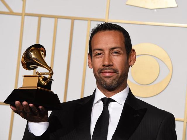 Composer Antonio Sanchez poses with his trophy for Best Score Soundtrack for Visual Media Birdman in the press room during the 58th Annual Grammy Music Awards in Los Angeles. (AFP) 