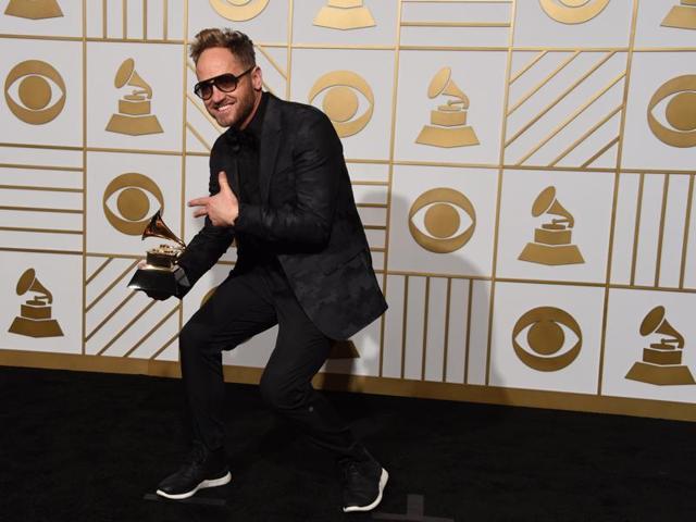 Tobymac poses with his Best Contemporary Christian Music Album This is Not A Test in the press room during the 58th Annual Grammy Music Awards in Los Angeles.  (AFP) 