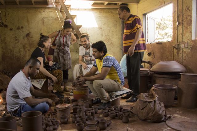 Founders Amanda Pinatih (second from left) and Jorge Mañes Rubio (fourth from left) with artisans in Dharavi (courtesy: design museum dharavi)