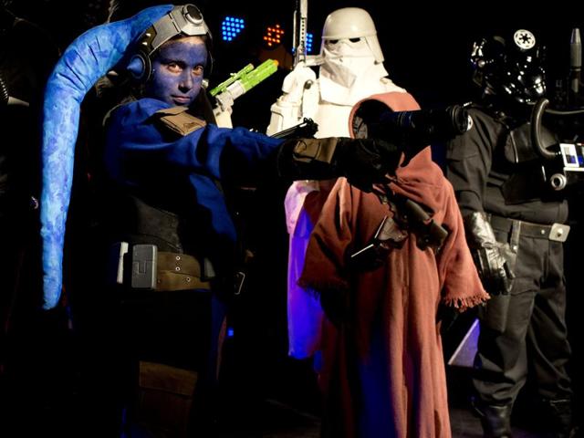 In this Feb. 14, 2016 photo, people dressed as Star Wars characters pose for pictures after parading at the annual Alien Festival in Capilla del Monte, Cordoba, Argentina, the site of an alleged UFO sighting 30 years ago. The festival, now in its fourth year, has become popular among alien enthusiasts worldwide. (AP Photo/Natacha Pisarenko) (AP) In this Feb. 14, 2016 photo, people dressed as Star Wars characters pose for pictures after parading at the annual Alien Festival in Capilla del Monte, Cordoba, Argentina, the site of an alleged UFO sighting 30 years ago. The festival, now in its fourth year, has become popular among alien enthusiasts worldwide. (AP Photo/Natacha Pisarenko) (AP)
