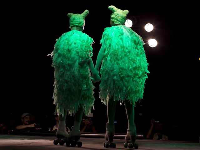 In this Feb. 12, 2016 photo, women dressed as aliens on rollers-skates stand on stage to compete in the alien costume contest in Capilla del Monte, Cordoba, Argentina, the site of an alleged UFO sighting 30 years ago. The festival, currently hosting its 4th edition, has caused some controversy as the more fervent believers feel it has put a frivolous twist on what they consider a serious phenomenon. (AP Photo/Natacha Pisarenko) (AP) In this Feb. 12, 2016 photo, women dressed as aliens on rollers-skates stand on stage to compete in the alien costume contest in Capilla del Monte, Cordoba, Argentina, the site of an alleged UFO sighting 30 years ago. The festival, currently hosting its 4th edition, has caused some controversy as the more fervent believers feel it has put a frivolous twist on what they consider a serious phenomenon. (AP Photo/Natacha Pisarenko) (AP)
