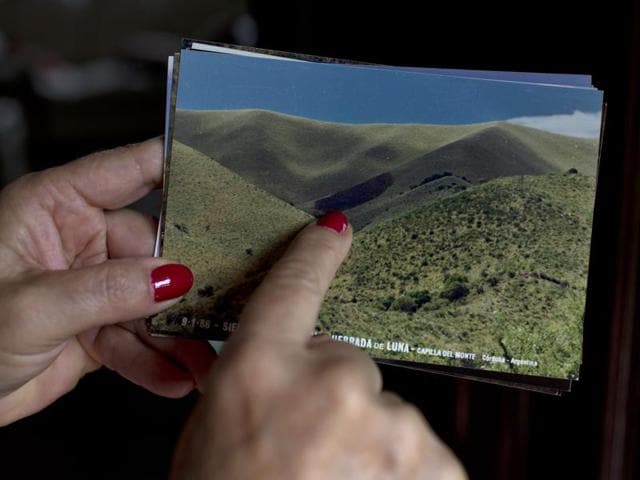 In this Feb. 13, 2016 photo, Luz Mary Lopez, director of the local Center of UFO Investigation, points to an area of burned grass in a picture taken near Uritorco Mountain, after the night of Jan. 9,1986 when a UFO was allegedly spotted near Capilla del Monte in Cordoba, Argentina. Since then, the site receives scientists to study the phenomenon, as well as a tourists who come for an annual Alien Festival. "The festival is fun, but it can also generate a lack of seriousness toward the issue," Lopez said. (AP Photo/Natacha Pisarenko) (AP) In this Feb. 13, 2016 photo, Luz Mary Lopez, director of the local Center of UFO Investigation, points to an area of burned grass in a picture taken near Uritorco Mountain, after the night of Jan. 9,1986 when a UFO was allegedly spotted near Capilla del Monte in Cordoba, Argentina. Since then, the site receives scientists to study the phenomenon, as well as a tourists who come for an annual Alien Festival. "The festival is fun, but it can also generate a lack of seriousness toward the issue," Lopez said. (AP Photo/Natacha Pisarenko) (AP)