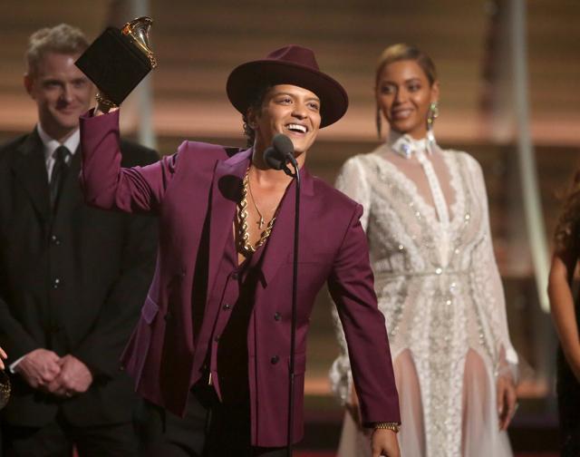 Bruno Mars accept the award for record of the year for Uptown Funk at the 58th annual Grammy Awards on Monday. (Matt Sayles/Invision/AP) Bruno Mars accept the award for record of the year for Uptown Funk at the 58th annual Grammy Awards on Monday. (Matt Sayles/Invision/AP)